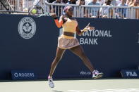 Coco Gauff hits a return to Aryna Sabalenka during the National Bank Open tennis tournament in Toronto, Thursday, Aug. 11, 2022. (Chris Young/The Canadian Press via AP)