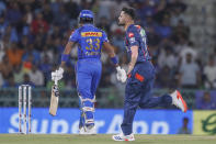 Lucknow Super Giants's Naveen-ul-Haq, right, celebrates the dismissal of Mumbai Indians' captain Hardik Pandya, left, during the Indian Premier League cricket match between Lucknow Super Giants and Mumbai Indians in Lucknow, India, Tuesday, April 30, 2024. (AP Photo/Pankaj Nangia)