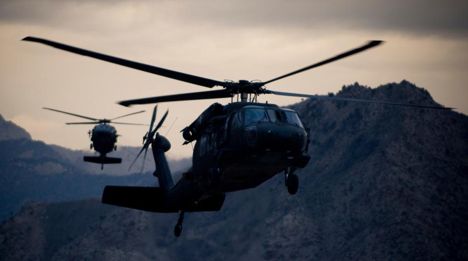 Two Army UH-60 Black Hawk helicopters prepare for landing at Forward Operating Base Kalagush, Sept. 7, 2008.