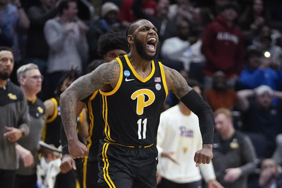 Pittsburgh's Jamarius Burton reacts after hitting the game-winning shot during the second half of a First Four game against Mississippi State in the NCAA men's college basketball tournament Tuesday, March 14, 2023, in Dayton, Ohio. (AP Photo/Darron Cummings)