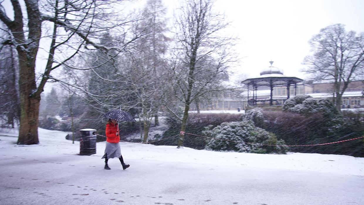 A person walks through Pavilion Gardens, Buxton, Peak District. Up to 25cm of snow is forecast in parts of England and Wales, as the Met Office issued weather alerts and warned of disruption to travel. Picture date: Thursday February 8, 2024.