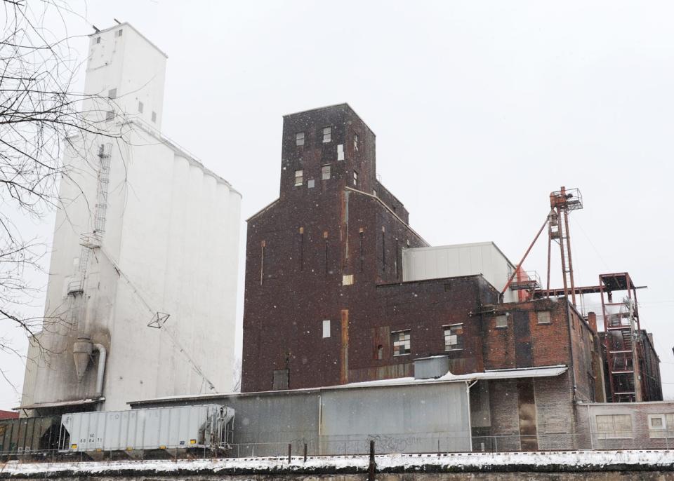 The exterior of the Star of the West Milling Co. in downtown Kent as seen before Friday's fire. The landmark white grain elevator, constructed in 1936, is 135 feet tall and can hold 200,000 bushels of whole grain. The brown elevator dates to the mill's inception in 1879 and can store 100,000 bushels.