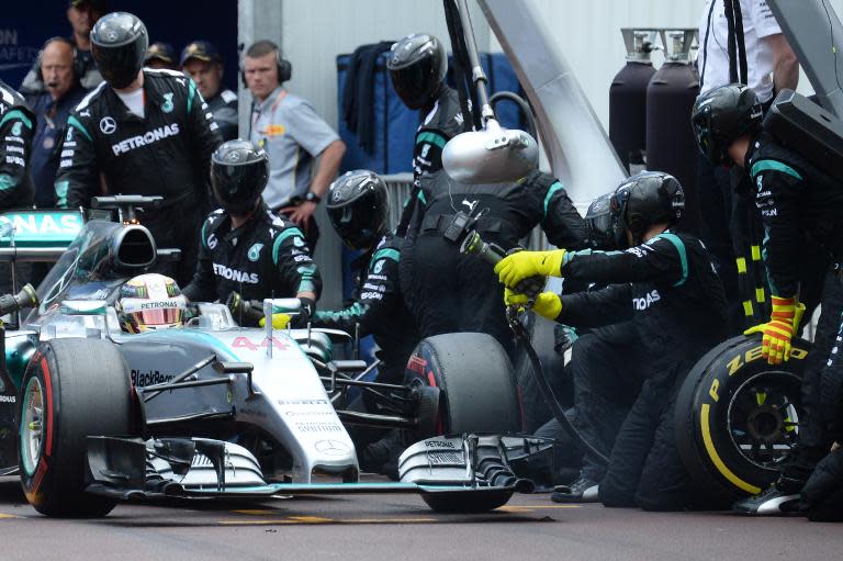 Mercedes AMG Petronas F1 Team's British driver Lewis Hamilton changes his tyres in the pits towards the end of the race at the Monaco street circuit in Monte-Carlo on May 24, 2015, during the Monaco Formula One Grand Prix