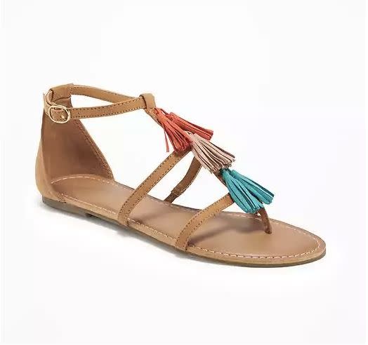 Buy <a href="http://oldnavy.gap.com/browse/product.do?cid=55147&amp;vid=1&amp;pid=618675032" target="_blank">Old Navy 'T-Strap Tassel' </a>sandals for $26.94