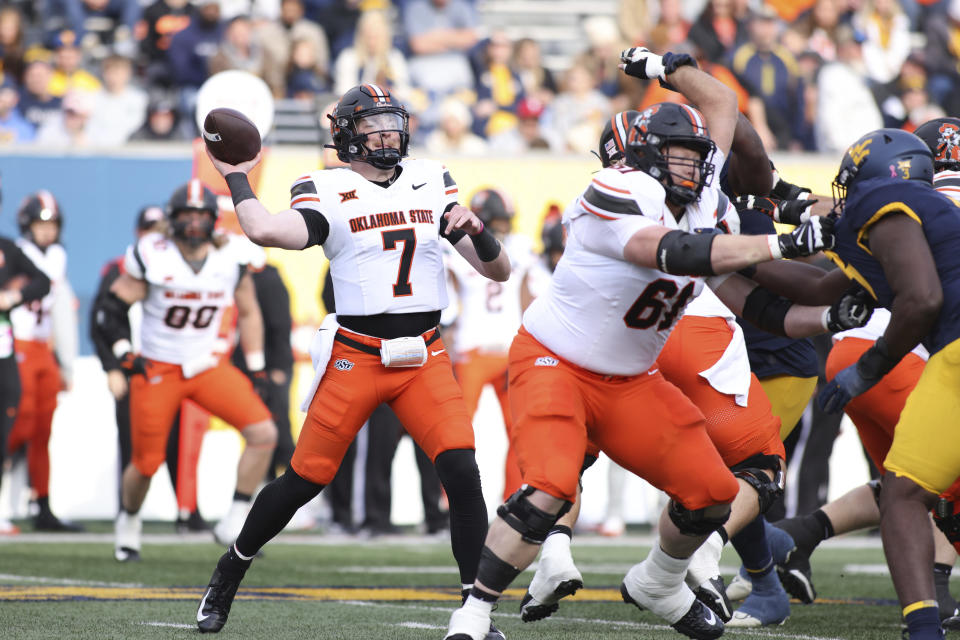 Oklahoma State quarterback Alan Bowman (7) attempts a pass during the first half of an NCAA college football game against West Virginia, Saturday, Oct. 21, 2023, in Morgantown, W.Va. (AP Photo/Chris Jackson)