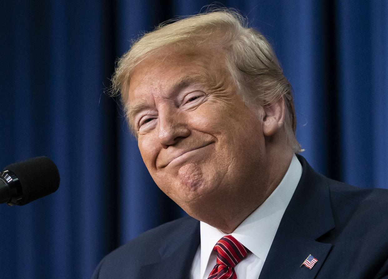 Then-President Donald Trump smiles as he speaks to members of the National Border Patrol Council at the White House in Washington, D.C. on Friday, Feb. 14, 2020. 