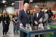 President Joe Biden tours SK Siltron CSS, a computer chip factory in Bay City, Mich., Tuesday, Nov. 29, 2022, with SK Siltron CSS CEO Jianwei Dong. (AP Photo/Patrick Semansky)