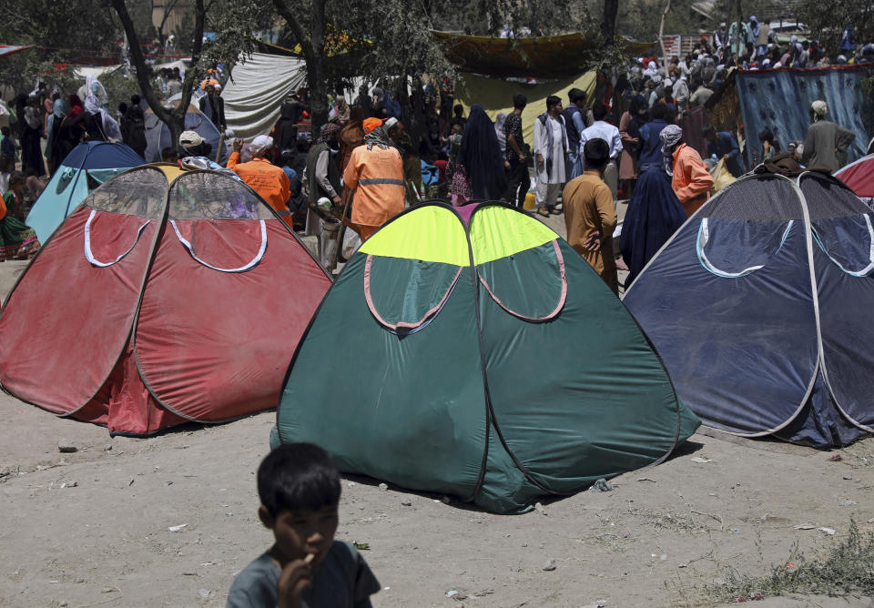 Internally displaced Afghans from northern provinces, who fled their home due to fighting between the Taliban and Afghan security personnel, take refuge in a public park in Kabul, Afghanistan, Tuesday, Aug. 10, 2021. (AP Photo/Rahmat Gul)