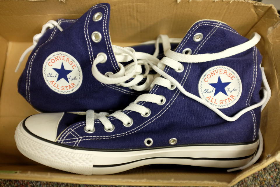 MIAMI, FL - OCTOBER 14:  Converse shoes are seen in a store on October 14, 2014 in Miami, Florida. Converse, owned by Nike, announced it is filing lawsuits against 31 companies, accusing them of trademark infringement on its widely recognizable Chuck Taylor shoe.  (Photo by Joe Raedle/Getty Images)