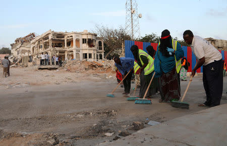 Somali volunteers clean the scene of last Saturday explosion in KM4 street in the Hodan district in Mogadishu, Somalia October 17, 2017. REUTERS/Feisal Omar