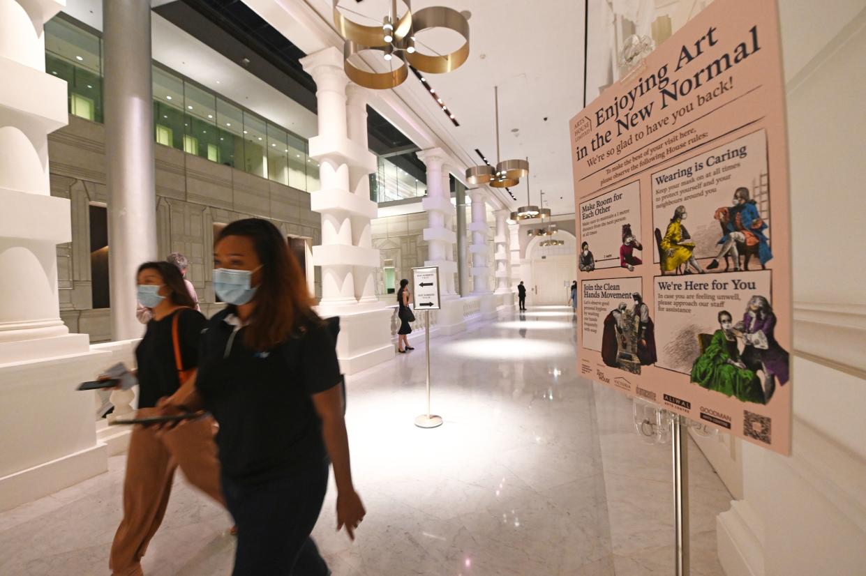 SINGAPORE, Oct. 8, 2020 -- People wearing masks attend the first live concert by Singapore Symphony Orchestra since the implementation of preventive measures against COVID-19 from April 7, 2020, at the Victoria Concert Hall in Singapore on Oct. 8, 2020. The live concert was attended by 50 people. (Photo by Then Chih Wey/Xinhua via Getty) (Xinhua/Then Chih Wey via Getty Images)