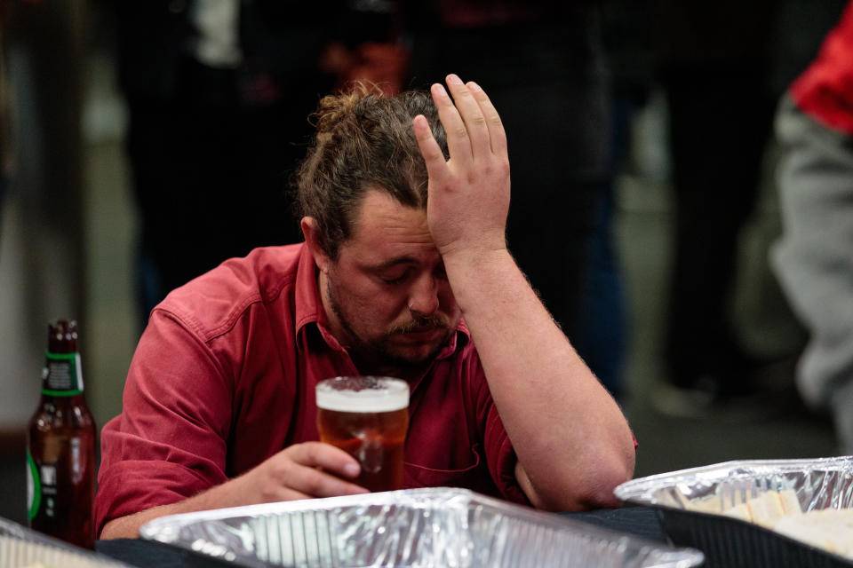 A man expresses his disappointment as he watches the live election results on TV at the Belmont Sports and Recreation Club on election day. Source: AAP 