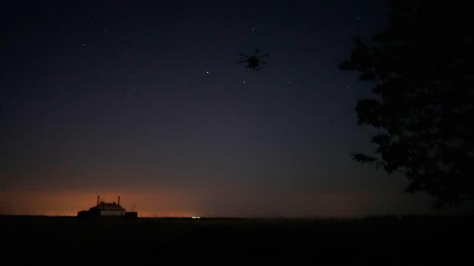 Twilight provides a moment of opportunity for the unit to set up new equipment and unload their Humvee before dark makes these complex tasks impossible. - Brice Lainé/CNN