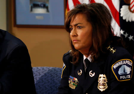 FILE PHOTO: Minneapolis Chief of Police Janee Harteau takes part in a round table discussion on ways to reduce gun violence during a visit to the Minneapolis Police Department Special Operations Center in Minneapolis, Minnesota, U.S. on February 4, 2013. REUTERS/Kevin Lamarque/File Photo