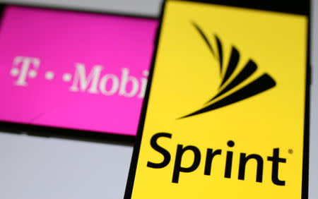 FILE PHOTO: Smartphones with the logos of T-Mobile and Sprint are seen in this illustration taken September 19, 2017. REUTERS/Dado Ruvic/Illustration/File Photo