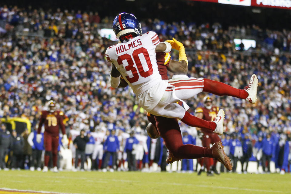 New York Giants cornerback Darnay Holmes (30) breaks up a pass intended for Washington Commanders wide receiver Curtis Samuel (10) during the second half of a NFL football game between the New York Giants and the Washington Commanders on Sunday, Dec. 18, 2022 at FedExField in Landover, Md. (Shaban Athuman/Richmond Times-Dispatch via AP)