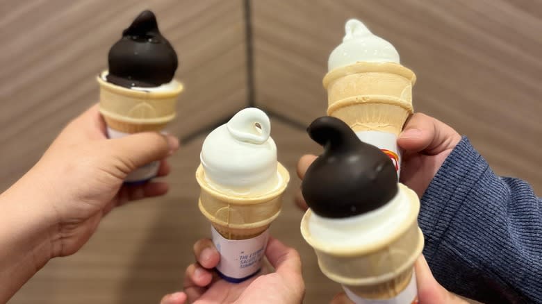 Hands holding Dairy Queen cones