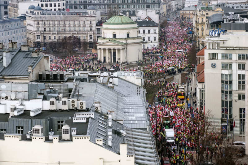 Farmers wave Polish flags during farmers protest in downtown Warsaw against the European Union's agricultural policies. Attila Husejnow/SOPA Images via ZUMA Press Wire/dpa