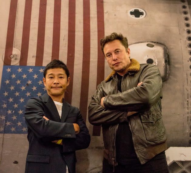 Japanese billionaire Yusaku Maezawa and SpaceX CEO Elon Musk strike a pose at SpaceX’s headquarters in Hawthorne, Calif. (Yusaku Maezawa via Twitter)