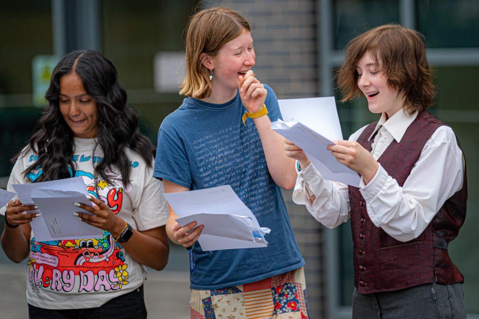 (from left) Anna Raveendran, Grace Ford and Miriam McGrath celebrate their results at St Mary Redcliffe and Temple School (Ben Birchall/PA) (PA Wire)