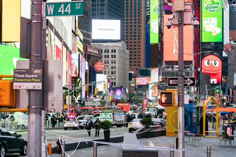 New York City police officers stand guard after a shooting incident in Times Square, New York