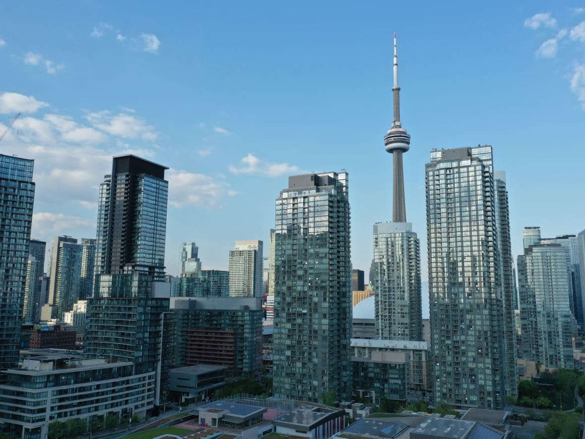 Some of Toronto's many condo buildings, as well as the CN Tower, are seen on May 18, 2021. Three of the four major parties in Ontario, all except the Progressive Conservatives, are pledging to bring back some form of rent control.  (John Badcock/CBC - image credit)