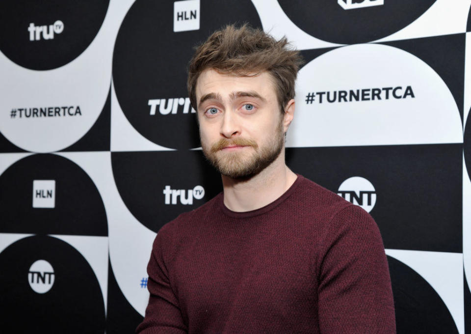 Daniel Radcliffe looking serious and casually dressed on the red carpet