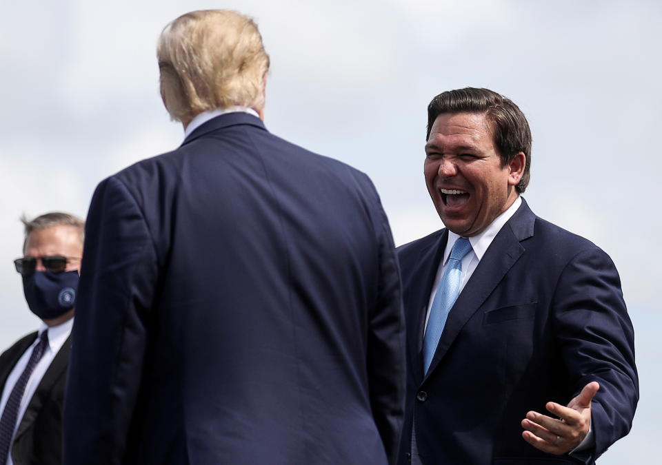 Ron DeSantis greets Donald Trump