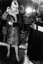 <p>The '60s brought a major cultural shift away from the conventional. Brigitte Bardot brings that mentality to her fall fashion, including a long fur coat, patterned stockings, and modern bangs.</p>