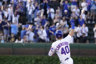 Chicago Cubs' Willson Contreras salutes the fans in the bleachers as he celebrates his grand slam off Pittsburgh Pirates relief pitcher Bryse Wilson during the first inning of a baseball game Monday, May 16, 2022, in Chicago. (AP Photo/Charles Rex Arbogast)