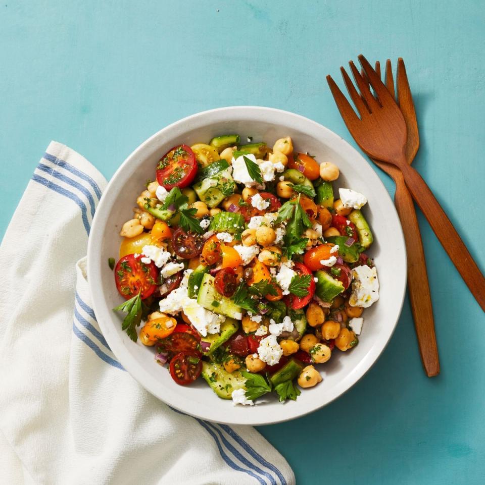 chickpea salad with smashed cucumbers in a bowl