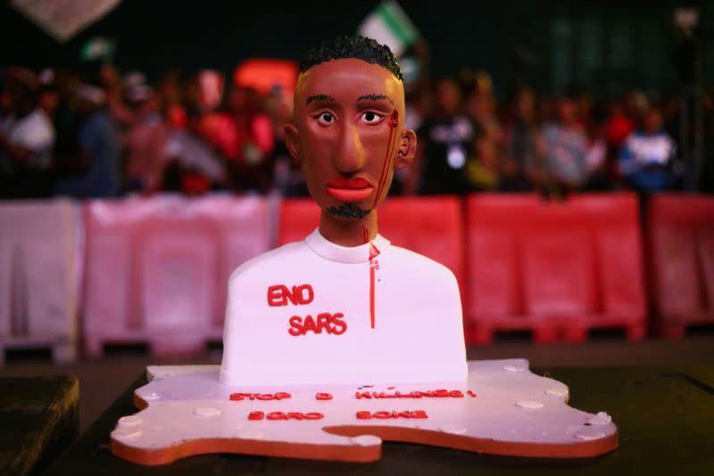 A cake moulded as a man with an inscription "End Sars", referring to the Special Anti-Robbery Squad (SARS), is pictured during a protest over police brutality in Lagos