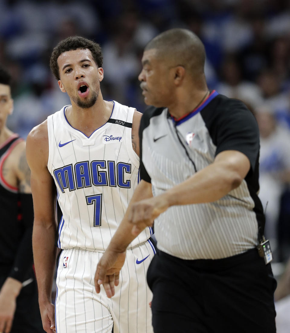 Orlando Magic's Michael Carter-Williams (7) disputes a ruling by referee Tony Brothers (25) during the first half in Game 3 of a first-round NBA basketball playoff series, Friday, April 19, 2019, in Orlando, Fla. (AP Photo/John Raoux)