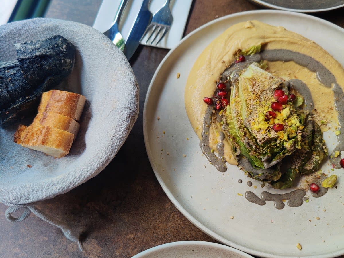 Hummus with black sesame cream, chopped pistachios and pomegranate (Adrianne Webster)