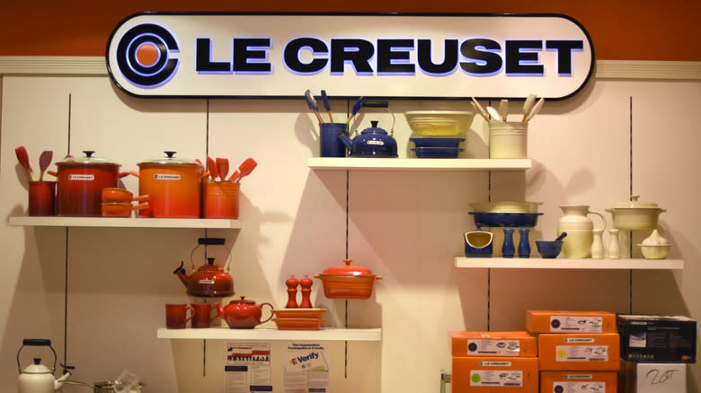 Le Creuset pots, pans and other kitchen items on display in the store window