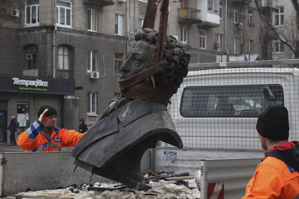 In this photo released by the Dnipro Region Administration, Municipal workers dismantle a monument of Russian writer Alexander Pushkin in the city centre of Dnipro, Ukraine, Friday, Dec. 16, 2022. Ukraine is accelerating efforts to erase the vestiges of centuries of Soviet and Russian influence from the public space by pulling down monuments and renaming hundreds of streets to honor home-grown artists, poets, military chiefs, and independence leaders, even heroes of this year's war. (Dnipro Region Administration via AP)