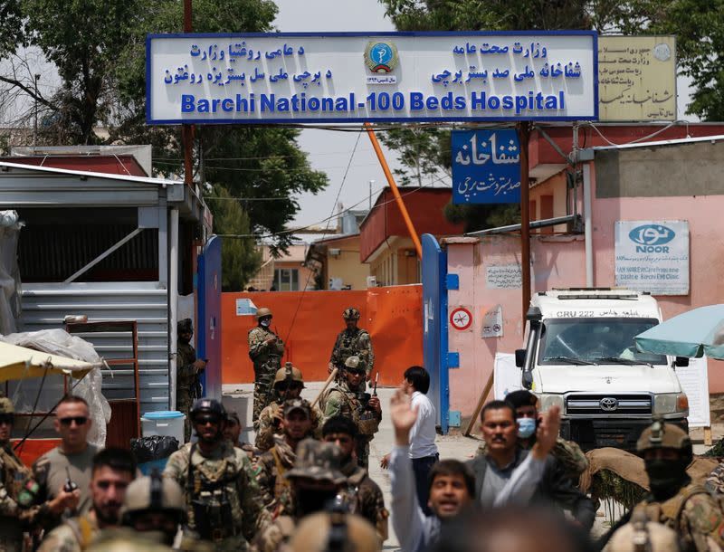 Afghan security forces stand guard outside Dasht-e-Barchi Hospital in Kabul