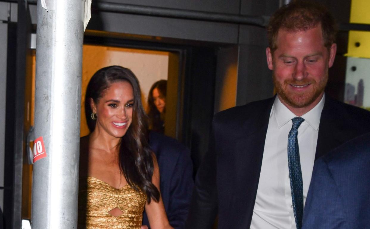 Prince Harry and Meghan, pictured leaving The Ziegfeld Theatre on Tuesday, claimed they were later involved in a 'near catastrophic car chase' with paparazzi photographers - GC Images