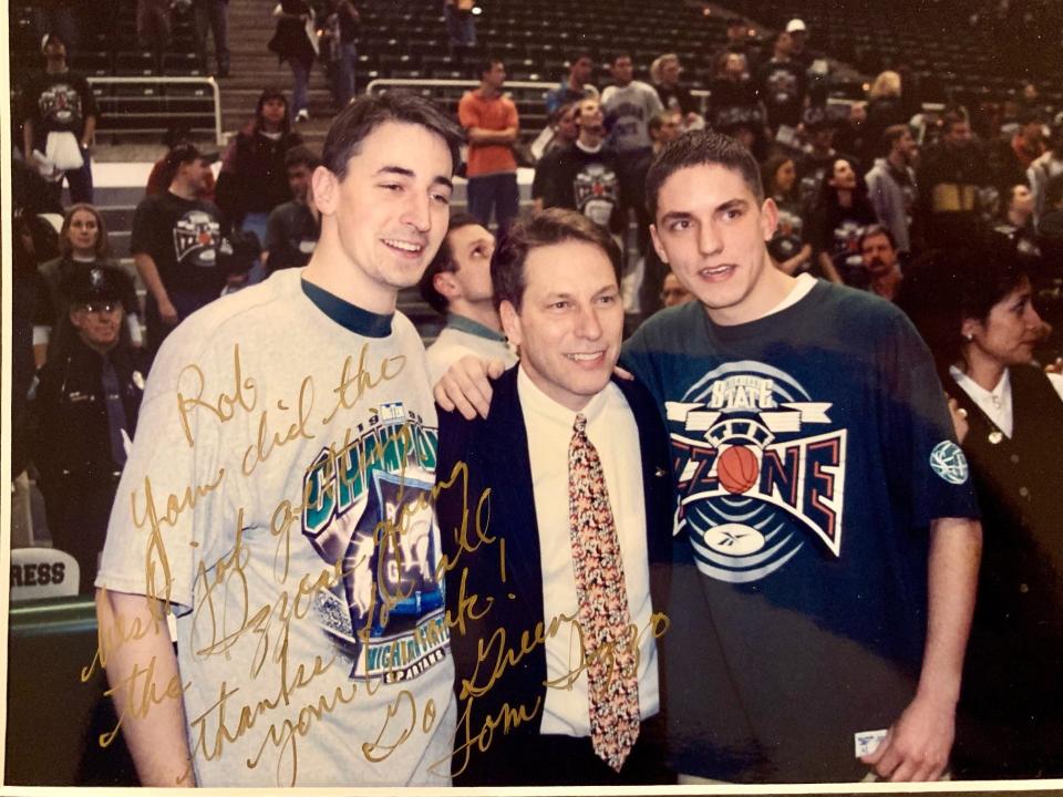 A photo of former Izzone co-directors Rob Myers and and Kevin Udy with Tom Izzo after MSU won the 1998-1999 Big Ten Championship.