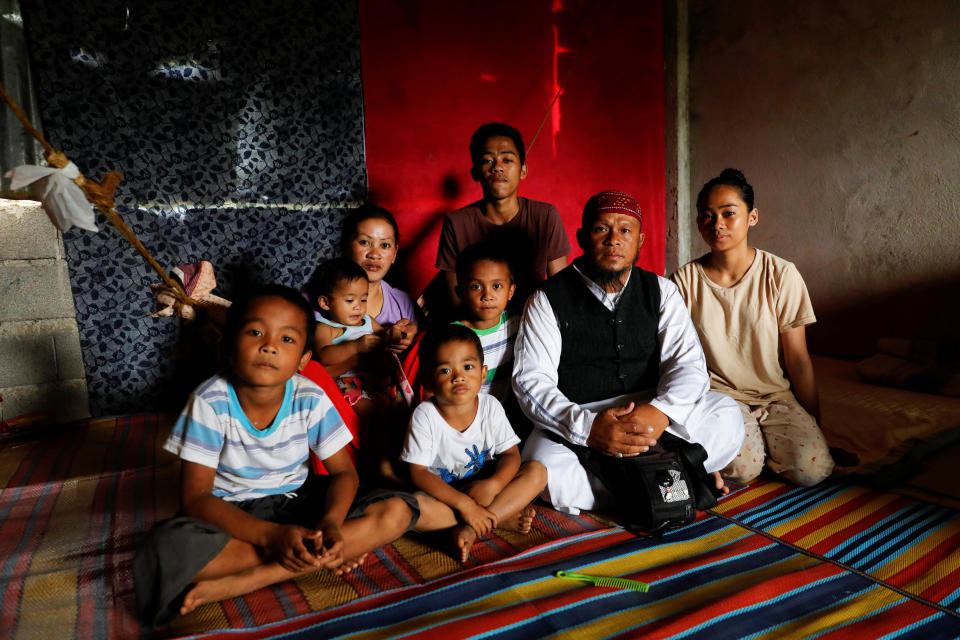 Mohammad Ali Acampong, 42, poses for a portrait with his family in a school-turned-evacuation center at Mipaga, Marawi City, Lanao del Sur province, Philippines. (Photo: Eloisa Lopez/Reuters)