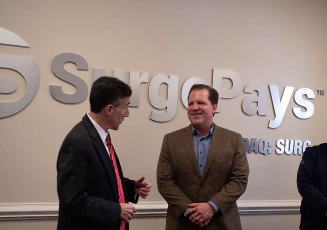 Tennessee Eighth District Congressman David Kustoff speaking with SurgePays CEO Brian Cox during meeting at SurgePays headquarters.