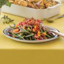 <p>Trade in green bean casserole for Jeweled Green Beans—a gorgeous platter of color, featuring red and yellow bell peppers, red onion, and crispy bacon. </p><p><a href="https://www.myrecipes.com/recipe/jeweled-green-beans" rel="nofollow noopener" target="_blank" data-ylk="slk:Jeweled Green Beans Recipe;elm:context_link;itc:0;sec:content-canvas" class="link ">Jeweled Green Beans Recipe</a></p>