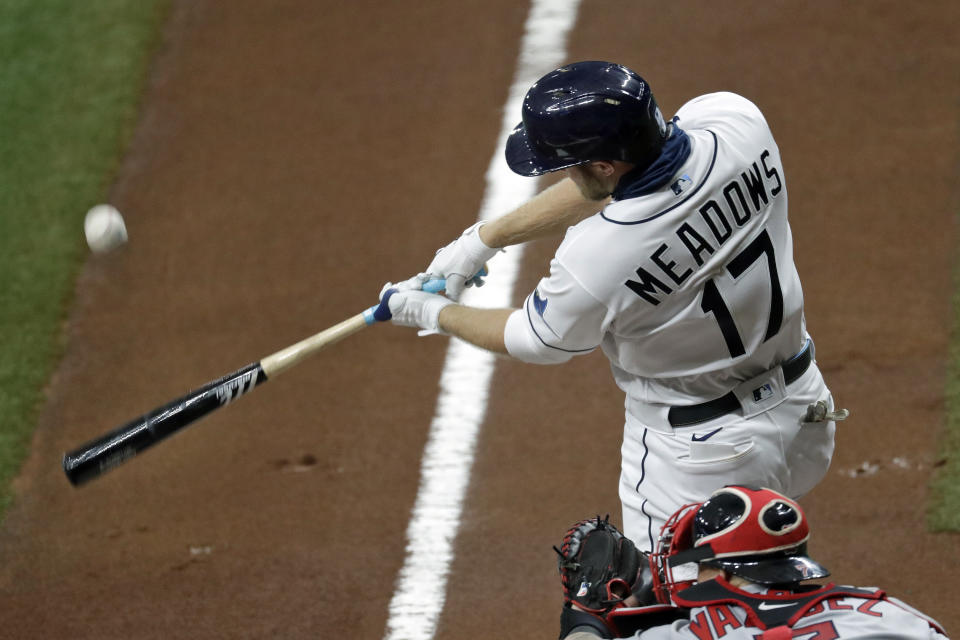 Tampa Bay Rays batter Austin Meadows fouls off a pitch from Boston Red Sox starting pitcher Nathan Eovaldi during the first inning of a baseball game Tuesday, Aug. 4, 2020, in St. Petersburg, Fla. Meadows is playing in his first game of the season after recovering from COVID-19. (AP Photo/Chris O'Meara)