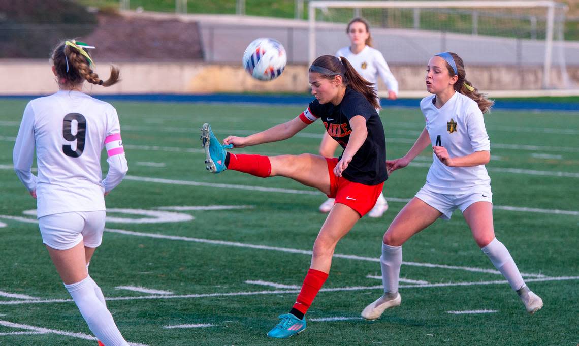 Mia Peterson, 3, of Oakdale High School kicks the ball over her head during the Sac-Joaquin Division III sectional championship game against Rio Americano on Thursday, Feb. 22, 2024, at Cosumnes River College. .