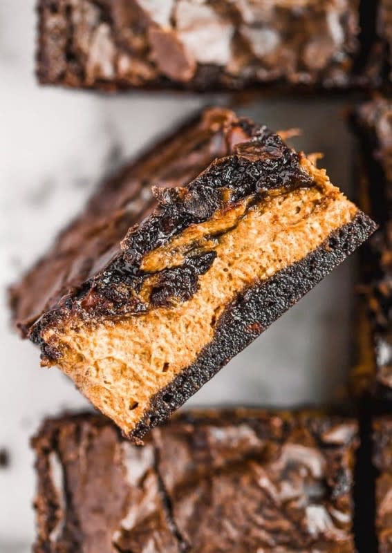 <p>The Cookie Rookie</p><p>Pumpkin brownies are the perfect mix of two of my favorite desserts: chocolate and pumpkin pie! This easy brownie recipe uses a boxed brownie mix of your choice with a layer of pumpkin in the middle to create something super fun and delicious. </p><p><strong>Get the recipe: <em><a href="https://www.thecookierookie.com/pumpkin-pie-brownies/" rel="nofollow noopener" target="_blank" data-ylk="slk:Pumpkin Pie Brownies;elm:context_link;itc:0;sec:content-canvas" class="link rapid-noclick-resp">Pumpkin Pie Brownies</a></em></strong></p><p><strong>Related: </strong><strong><a href="https://parade.com/1056242/marynliles/pumpkin-patch-near-me/" rel="nofollow noopener" target="_blank" data-ylk="slk:The Best Pumpkin Picking Spots Near You;elm:context_link;itc:0;sec:content-canvas" class="link rapid-noclick-resp">The Best Pumpkin Picking Spots Near You</a></strong></p>