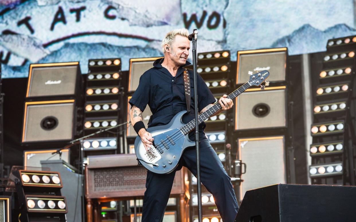 Mike Dirnt performs with Green Day