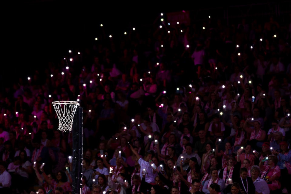 Fans used their phones as torches during a Super Netball game.