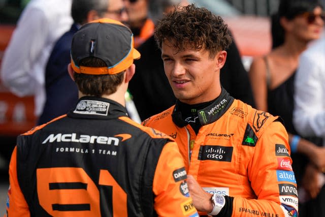 McLaren driver Lando Norris (right) talks to team-mate Oscar Piastri 