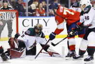 Florida Panthers left wing Frank Vatrano (77) scores a goal past Arizona Coyotes goaltender Karel Vejmelka (70) during the second period of an NHL hockey game, Monday, Oct. 25, 2021, in Sunrise, Fla. (AP Photo/Michael Reaves)