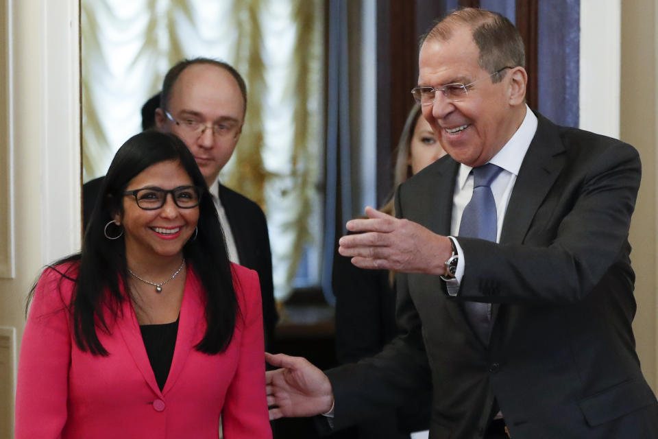 Russian Foreign Minister Sergey Lavrov, right, welcomes Venezuela's Vice President Delcy Rodriguez for talks in Moscow, Russia, Friday, March 1, 2019. (AP Photo/Pavel Golovkin)